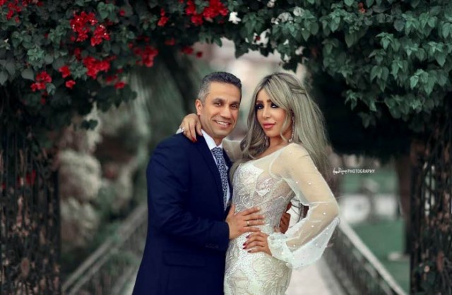 الإعلامية إيمان أبو طالب وزوجها العقيد محمد سمير
